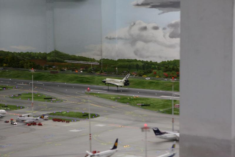 2013-07-26 22:23:36 ** Germany, Hamburg, Miniature Wonderland ** After a short announcement, even Space Shuttle Atlantis lands at the airport.