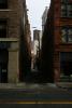 Small alleyway in downtown Seattle. On the right is part of the "L.C. Smith Tower".