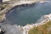 A small hot pond directly at the Firehole River.