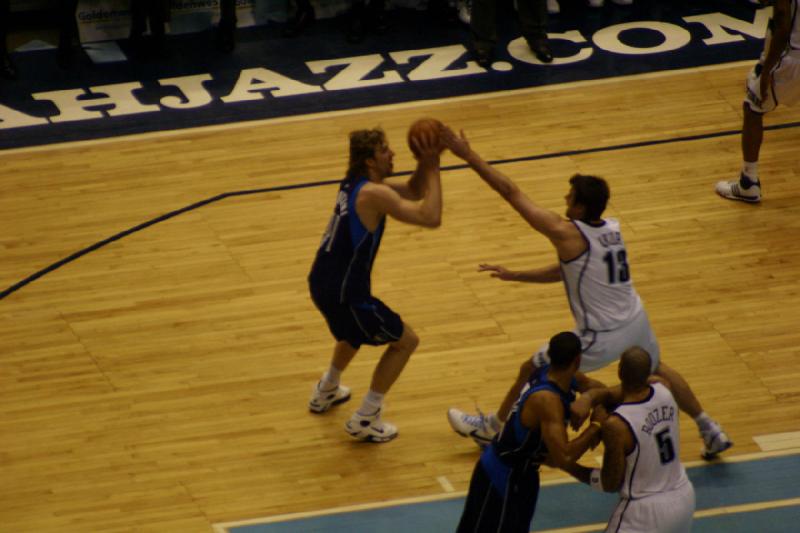 2008-03-03 20:10:24 ** Basketball, Utah Jazz ** Mehmet Okur tries to prevent a shot by Dirk Nowitzki.