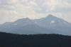On the right side is the mountain with the cross of snow and on the left side is the mountain with the notch.