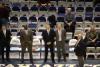 Jerry Sloan, with the gray suit in the middle of the picture, is the coach of the Jazz.