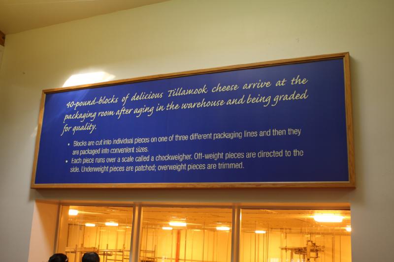 2011-03-25 15:56:30 ** Tillamook Cheese Factory ** 40-pound blocks of delicious Tillamook cheese arrive at the packaging room after aging in the warehouse and being graded for quality. Blocks are cut into individual pieces on one of three different packaging lines and then they are packaged into convenient sizes. Each piece runs over a scale called checkweigher. Off-weight pieces are directed to the side. Underweight pieces are patched; overweight pieces are trimmed.